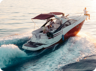 Picture of four people in a motor boat with one person sitting on the bow of the boat